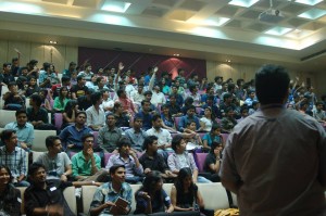 Students Raising hands to answer quiz to win goodies.